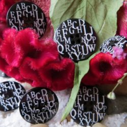 Bouton - Lettres noires sur fond blanc