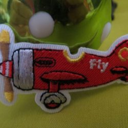 Motif - Avion rouge à hélice