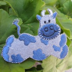 Motif - Vache souriante bleue et grise